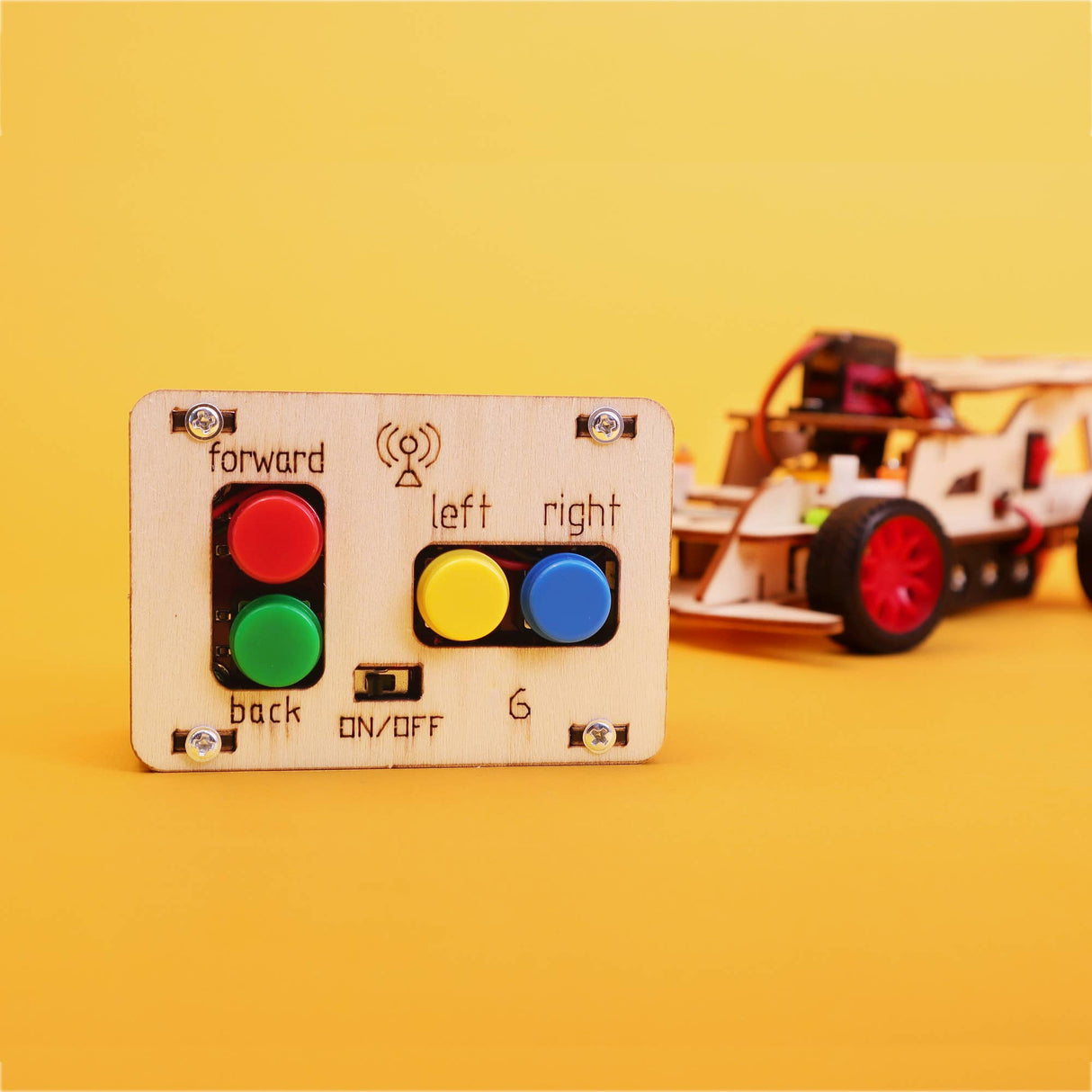 Control panel with buttons for a toy car on a yellow background