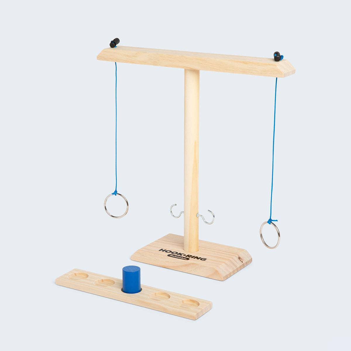 Wooden ring game with blue rings on a white background