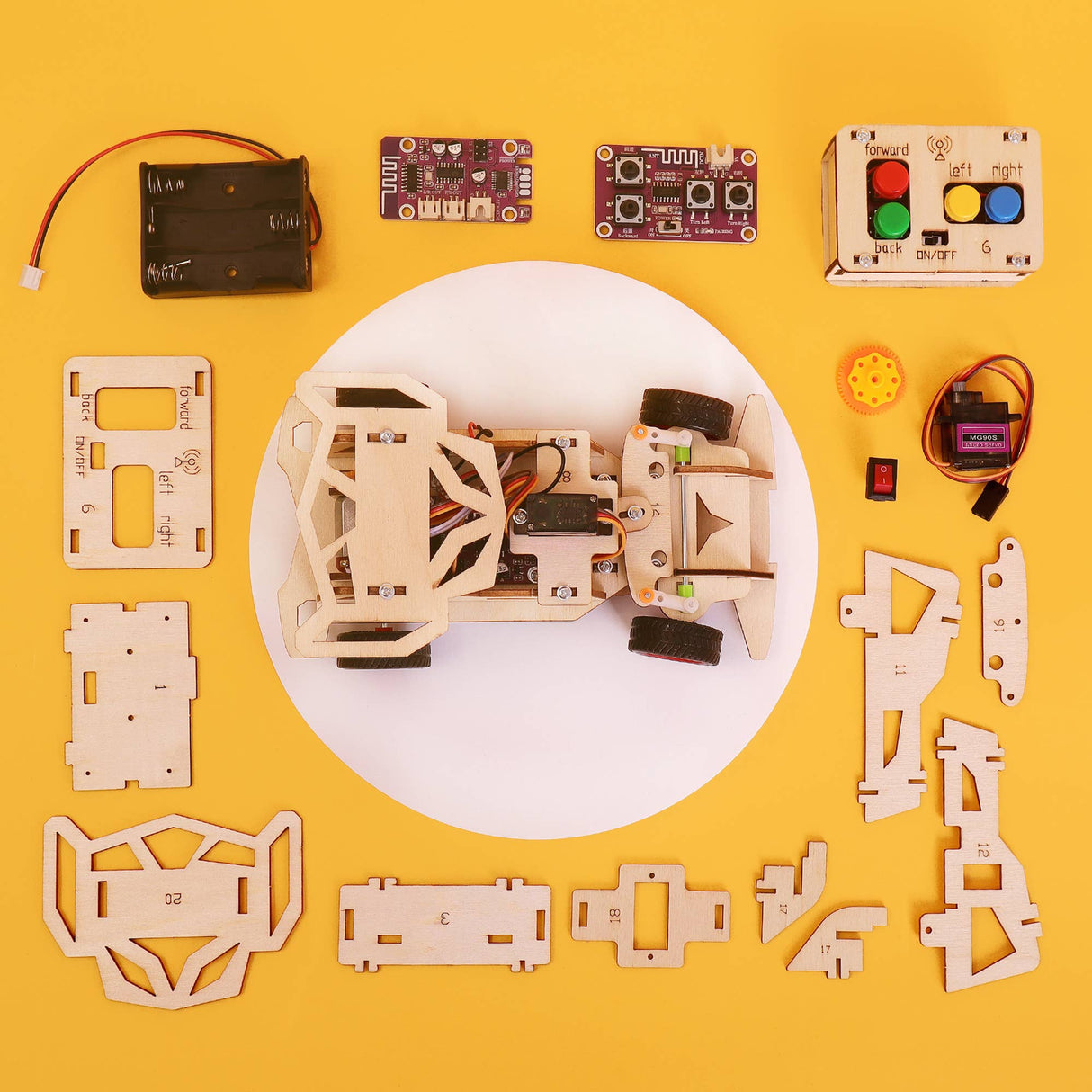 Robotics kit components on a yellow background