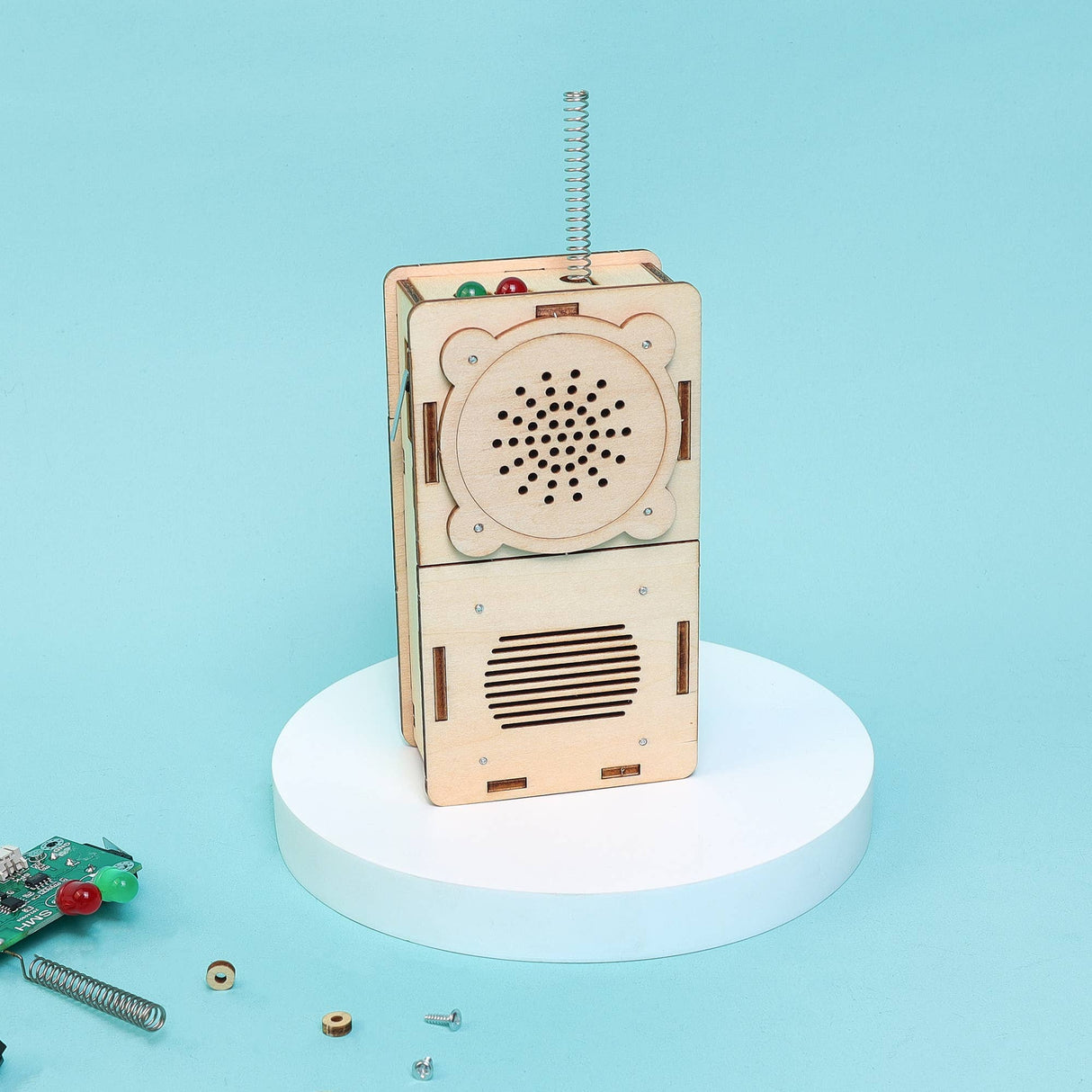 Wooden electronic device with components on a blue background
