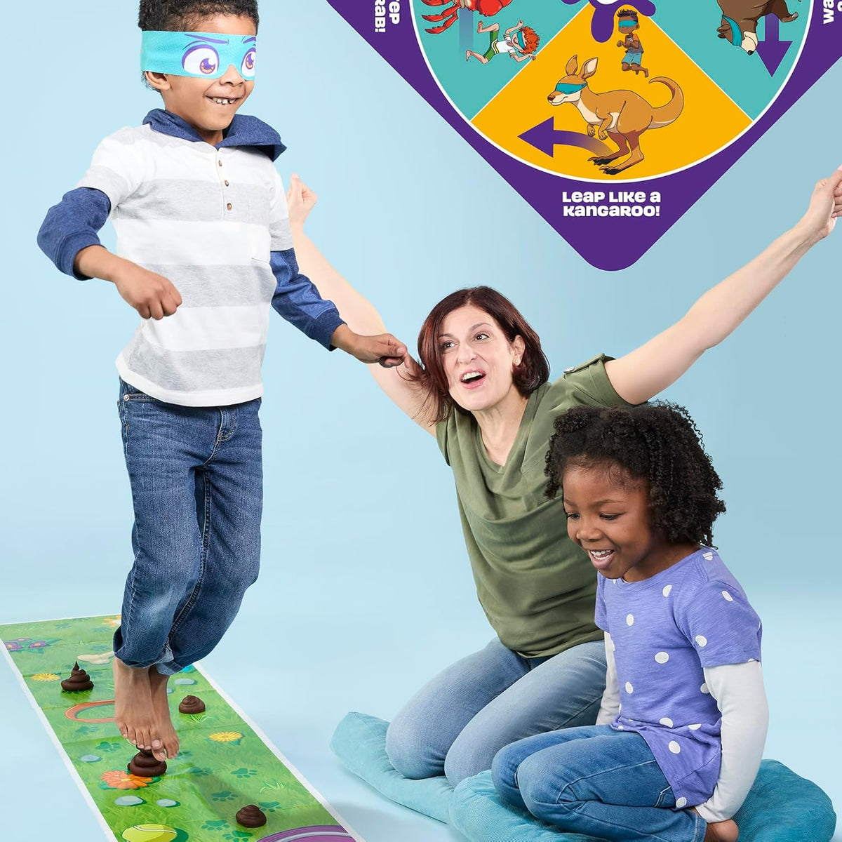Family playing Don't Step In It! with a blindfolded player crossing the mat