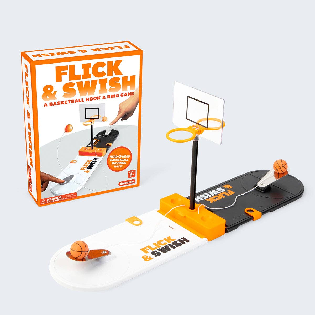 Flick & Swish basketball game set with packaging on a light gray background