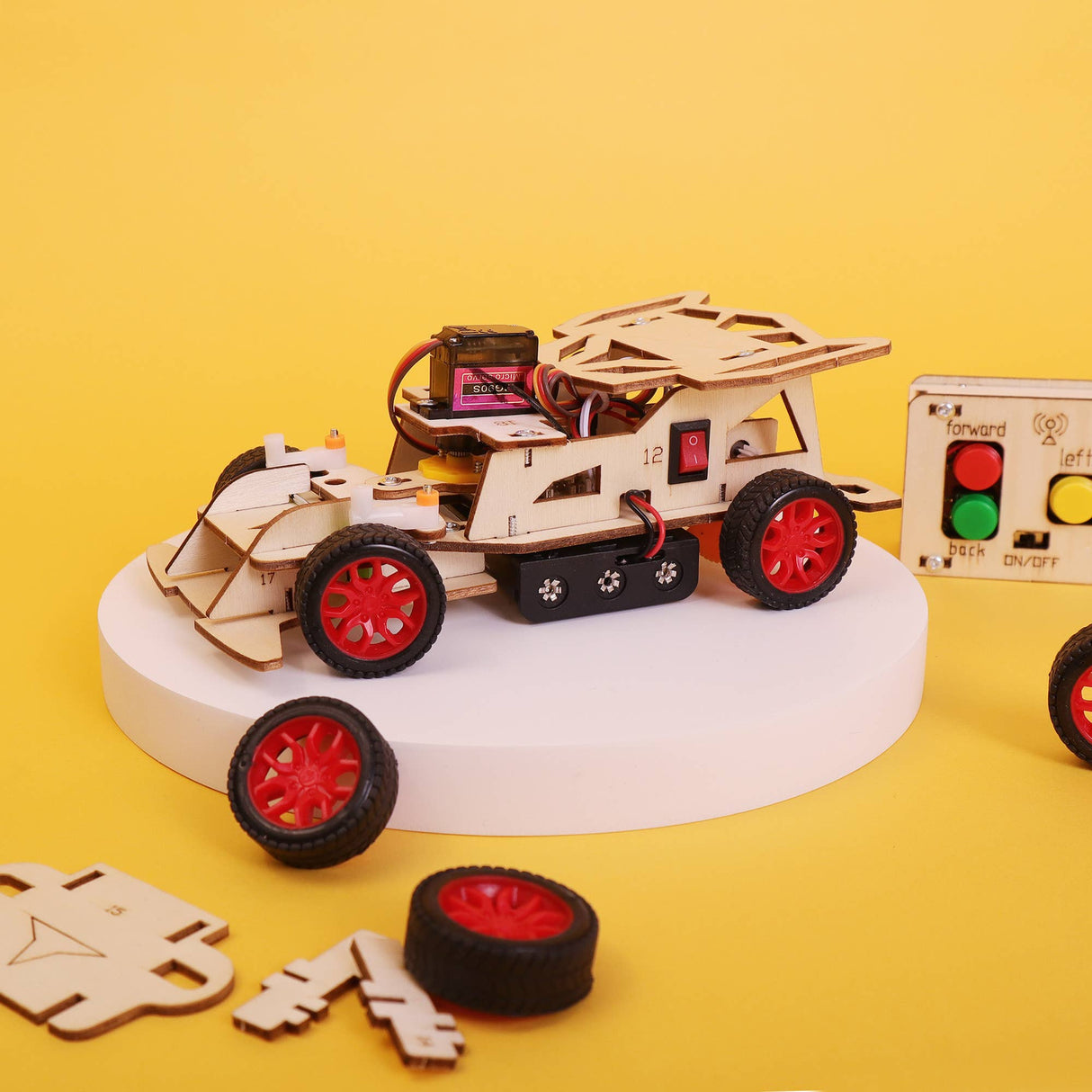 Wooden toy truck with red wheels on a yellow background