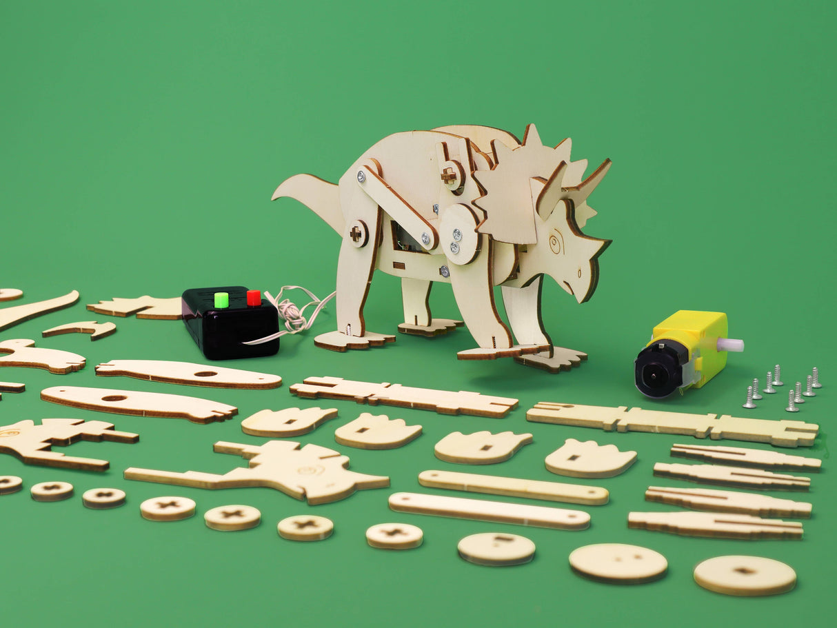 Wooden dinosaur model kit with pieces and tools on a green background