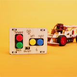 Control panel with buttons for a toy car on a yellow background