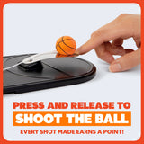 Hand pressing a button on a device with a small basketball attached, against a white background.