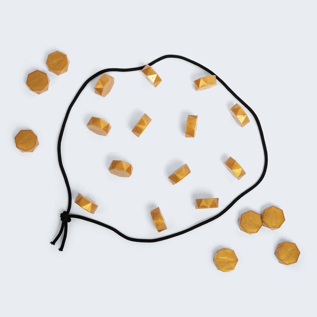 Necklace with gold geometric pendants on a white background