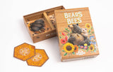Board game box with hexagonal cards featuring bears and bees on a white background
