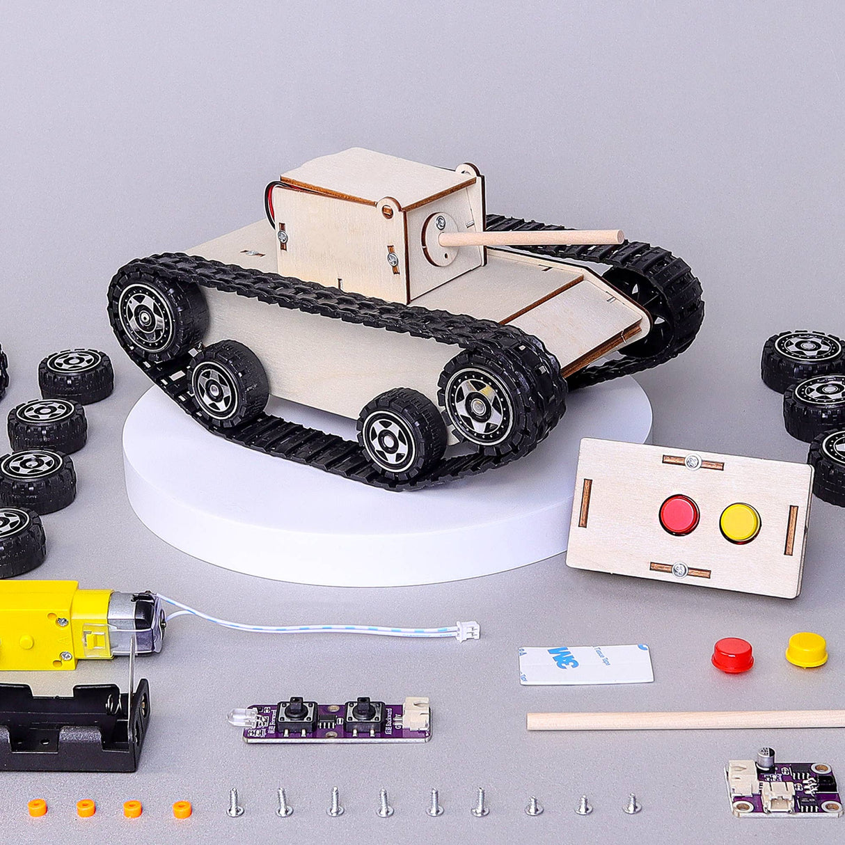 Wooden tank model kit with components on a gray background