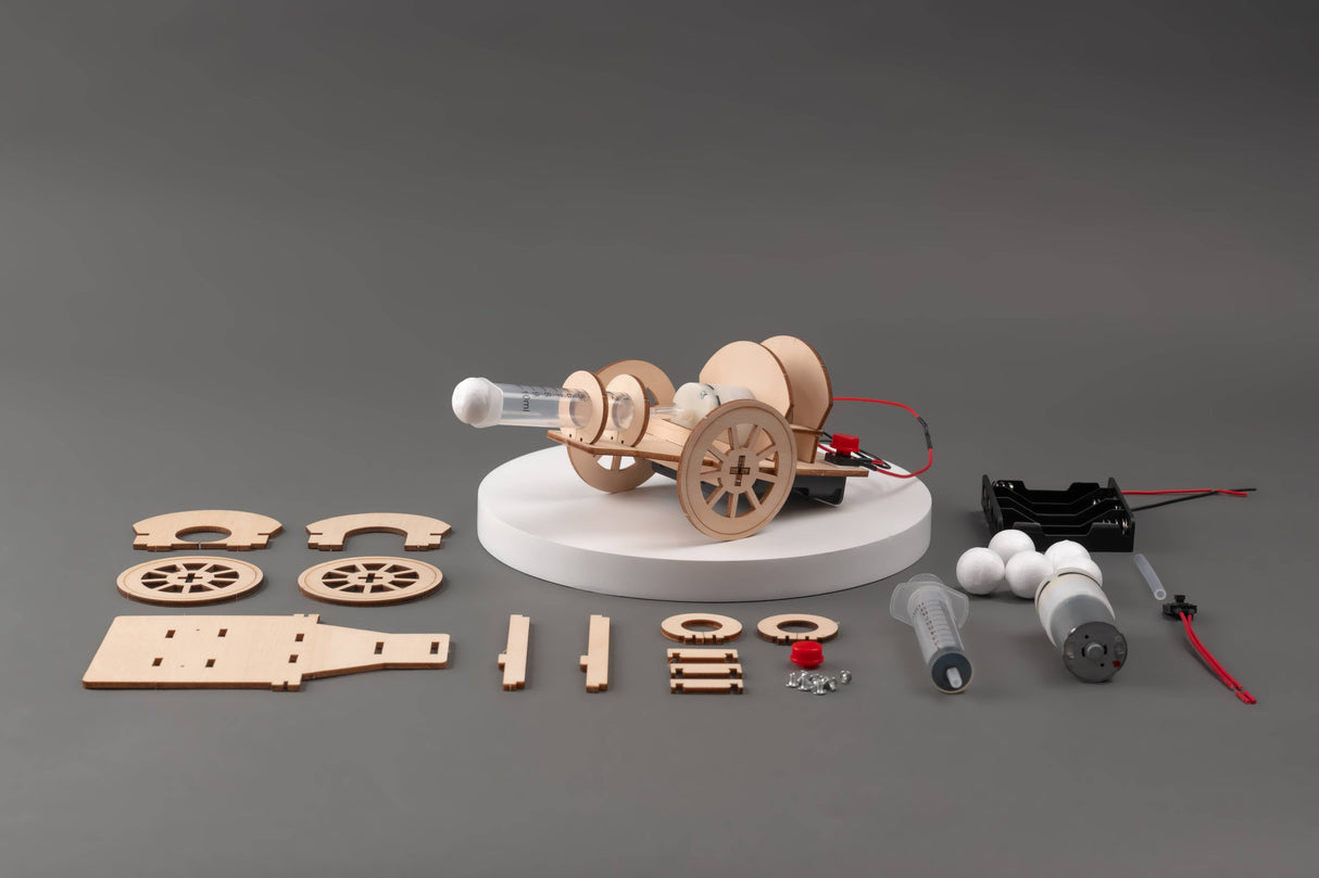 Model car kit with components on a gray background