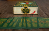 Vintage-style book with 'Gnomes' on the cover, open to reveal green and gold pages on a wooden surface.