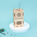 Wooden electronic device with components on a blue background