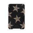 A slim black card holder wallet featuring a pattern of large beige and brown leopard-print stars, with a small black grip at the bottom and the brand name 'VELVET CAVIAR' printed vertically on the right side.