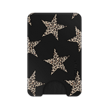 A slim black card holder wallet featuring a pattern of large beige and brown leopard-print stars, with a small black grip at the bottom and the brand name 'VELVET CAVIAR' printed vertically on the right side.