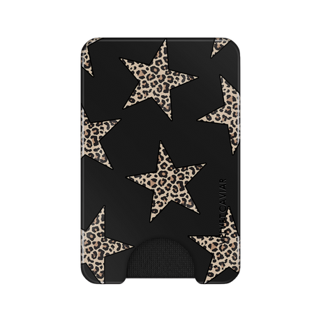 A slim black card holder wallet featuring a pattern of large beige and brown leopard-print stars, with a small black grip at the bottom and the brand name 'VELVET CAVIAR' printed vertically on the right side.