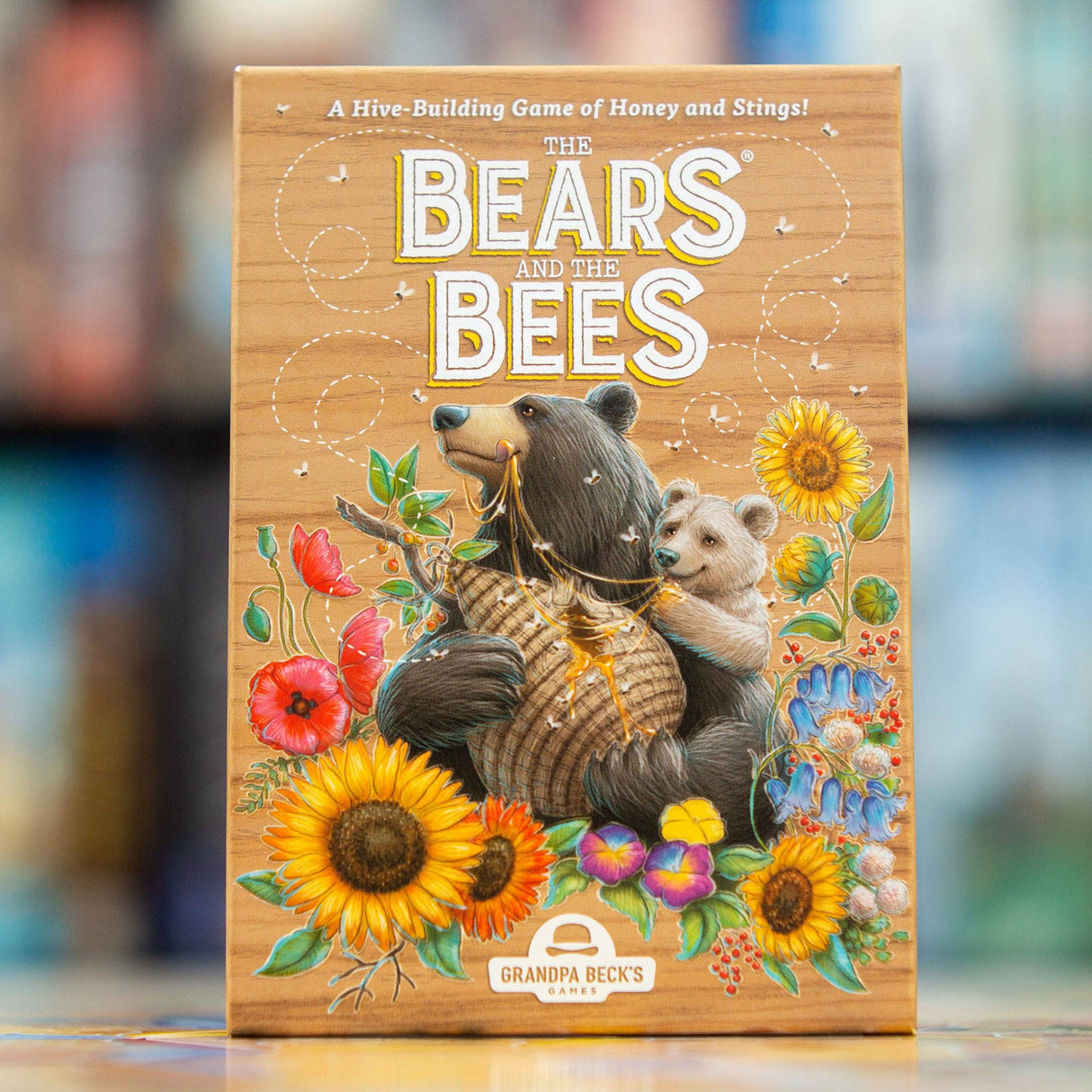 Board game box titled 'The Bears and the Bees' with bears and flowers on a wooden background.