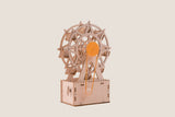 Wooden mechanical model of a Ferris wheel on a beige background