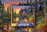 Springbok Sun Kissed Cabin 500 Piece Jigsaw Puzzle for Adults Features a Fishing Cabin by The Lake in a Colorful Illustration