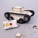 Wooden tank model kit with control panel and components on a gray background