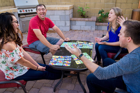 Group playing SKYJO outdoors