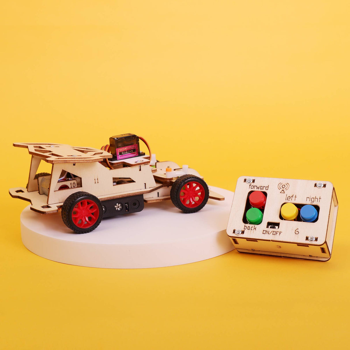 Toy car with remote control on a yellow background
