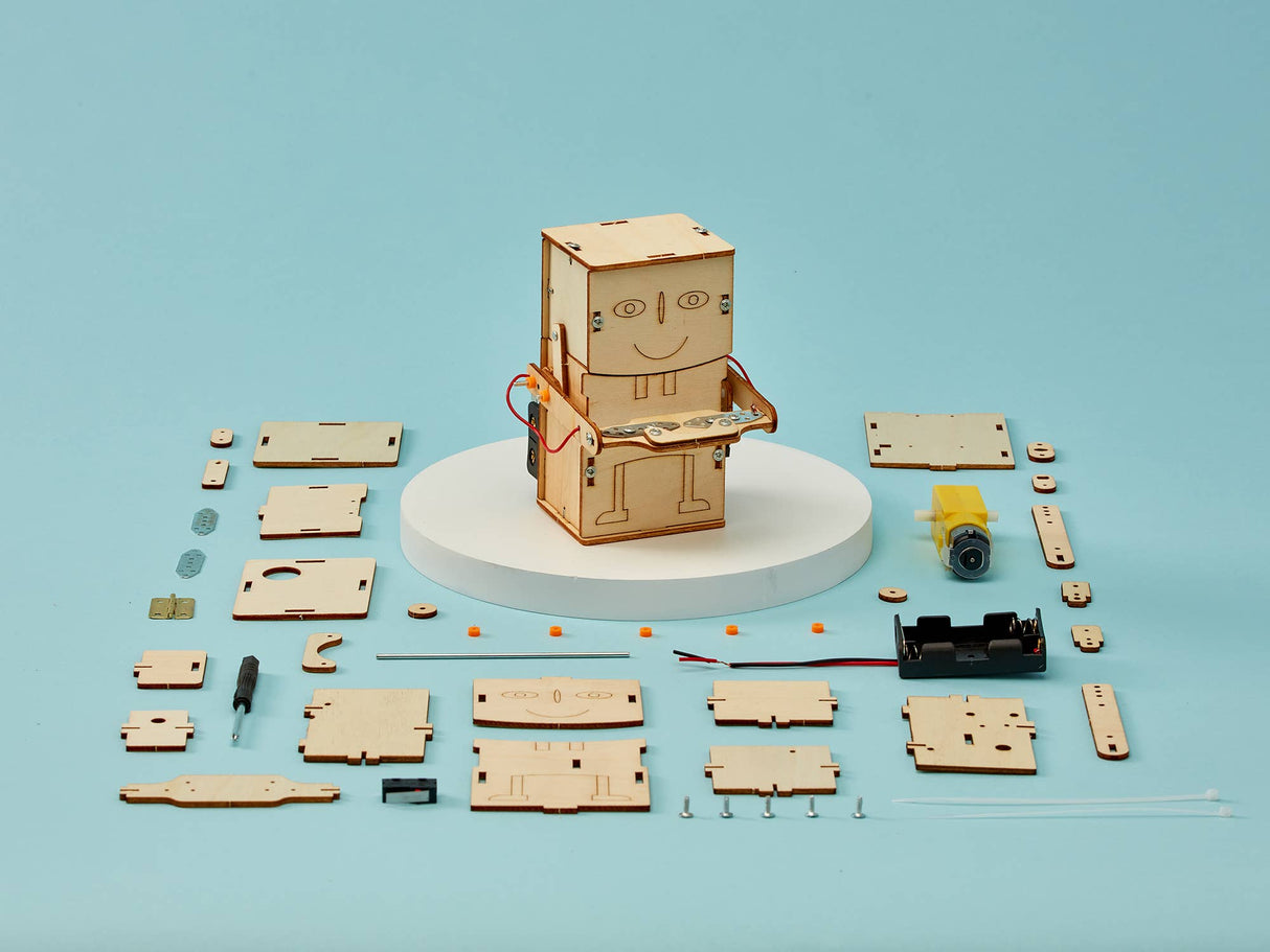 Wooden robot model kit with components on a blue background
