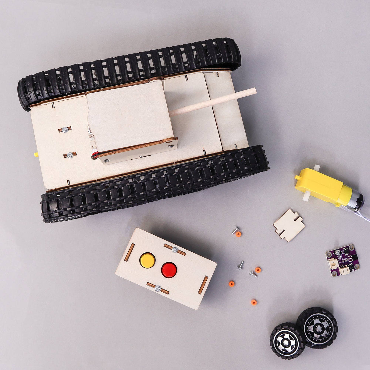 Mechanical model kit with components on a gray background