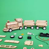 Wooden toy train set with components on a green background