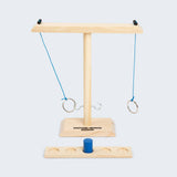 Wooden hooking game with rings on a white background