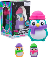 NeeDoh Polar Glow Penguin toy with packaging and additional penguins in different colors.