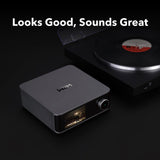 Wireless audio receiver with turntable on a dark background, featuring the brand 'WOW'.