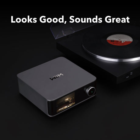 Wireless audio receiver with turntable on a dark background, featuring the brand 'WOW'.