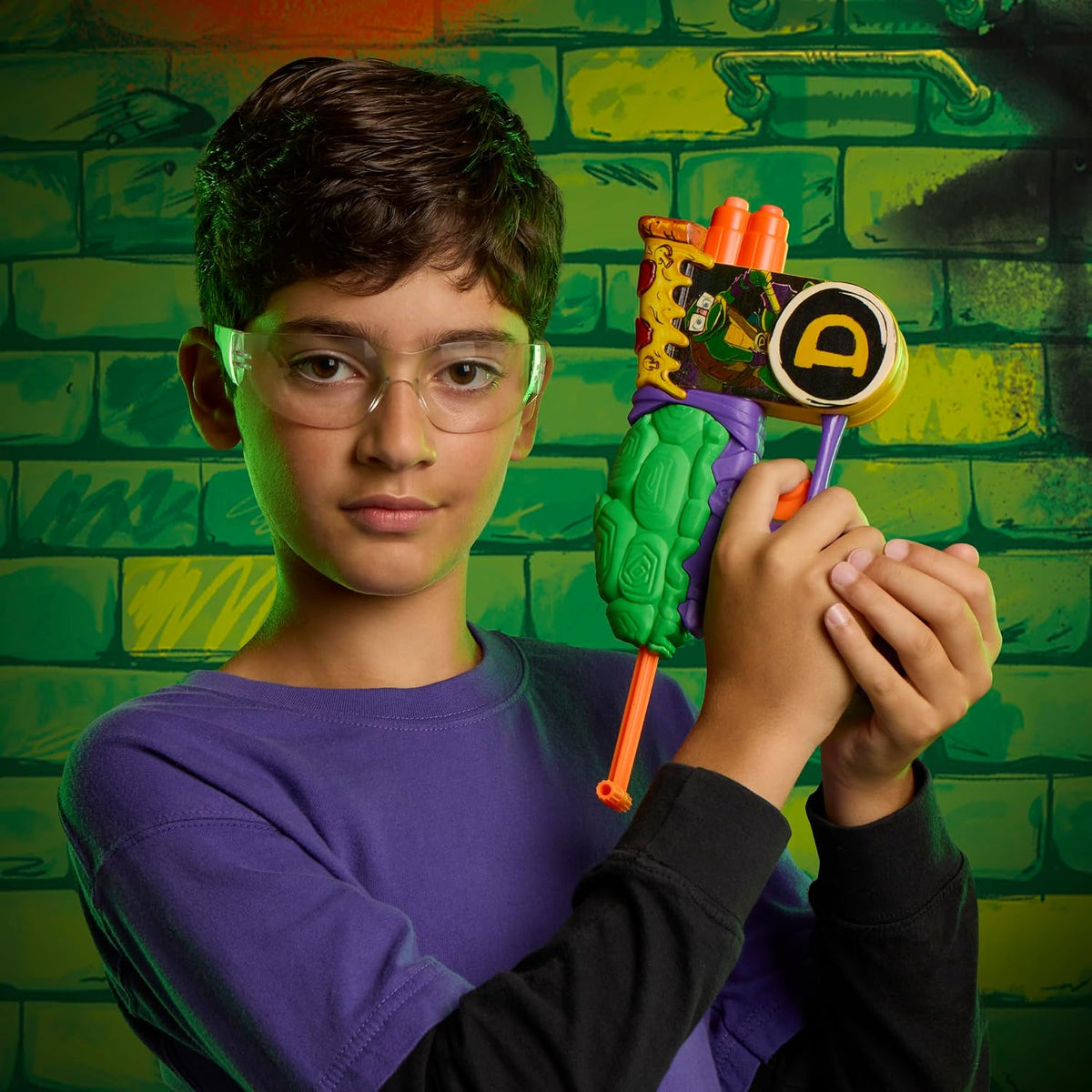 Kid wearing eyewear aiming the Nerf TMNT Donatello Blaster