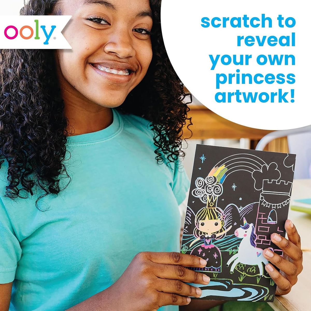 OOLY Scratch & Scribble: Princess Garden - child holding a finished princess scratch art card