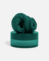 Speks Blur calming focus putty in Forest dark green on its container